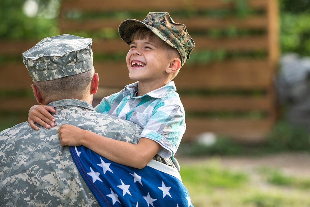 Photo of a soldier holding a boy